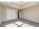 A well-lit bedroom features plush carpeting, a tray ceiling, and a closet with classic white doors at 3835 Rifflepool Ct, Douglasville, GA 30135