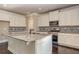 Stylish kitchen features white cabinets, granite countertops, stainless appliances, and patterned tile backsplash at 3835 Rifflepool Ct, Douglasville, GA 30135