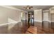 Spacious living area with dark hardwood floors, neutral paint, crown molding and an open floor plan at 3835 Rifflepool Ct, Douglasville, GA 30135