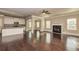 Spacious open-concept layout with kitchen island, fireplace, hardwood floors, and abundant natural light at 3835 Rifflepool Ct, Douglasville, GA 30135