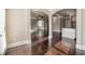 Open-concept living area with hardwood floors and decorative arches, offering a spacious and inviting atmosphere at 3835 Rifflepool Ct, Douglasville, GA 30135