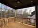 Enjoy outdoor living on this back porch, perfect for relaxation and overlooking lush greenery and backyard views at 6120 Hutchins Dr, Buford, GA 30518