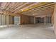 Large unfinished basement with visible framing, offering endless possibilities for customization at 6120 Hutchins Dr, Buford, GA 30518