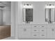 Bathroom featuring double vanity with marble countertop and matte black fixtures at 6120 Hutchins Dr, Buford, GA 30518