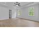 Large bedroom with hardwood floors, recessed lighting, ceiling fan, and walk-in closet at 6120 Hutchins Dr, Buford, GA 30518