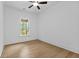 Bedroom featuring light wood floors and a window at 6120 Hutchins Dr, Buford, GA 30518