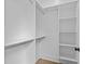 Spacious closet boasts custom shelving and ample storage, perfect for organization at 6120 Hutchins Dr, Buford, GA 30518