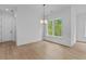 Bright dining room featuring a window with green views at 6120 Hutchins Dr, Buford, GA 30518