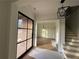 Elegant entryway featuring hardwood floors, a modern chandelier, and large windows for abundant natural light at 6120 Hutchins Dr, Buford, GA 30518