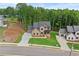 Beautiful home features a manicured lawn and a long drive at 6120 Hutchins Dr, Buford, GA 30518