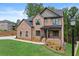 Beautiful two-story brick home with a covered porch and professionally landscaped front yard at 6120 Hutchins Dr, Buford, GA 30518
