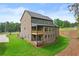 Beautiful two-story home with a brick and siding exterior and a well-manicured lawn at 6120 Hutchins Dr, Buford, GA 30518