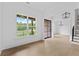 Bright foyer featuring hardwood floors, white walls, and an elegant view of the dining room at 6120 Hutchins Dr, Buford, GA 30518
