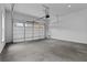 Expansive garage features an automatic door, concrete floors and room for multiple vehicles at 6120 Hutchins Dr, Buford, GA 30518
