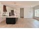 Gourmet kitchen with large island, stainless steel appliances, custom cabinets, and tile backsplash at 6120 Hutchins Dr, Buford, GA 30518