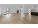 Hardwood floors throughout with a modern fireplace, balcony, and kitchen offering a bright and open living space at 6120 Hutchins Dr, Buford, GA 30518