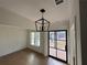 Elegant living room with black framed windows and a decorative light fixture at 6120 Hutchins Dr, Buford, GA 30518
