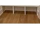 Mudroom features wood floors and a built in bench for shoe and coat storage at 6120 Hutchins Dr, Buford, GA 30518