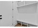 Mudroom area featuring a built-in bench with cubbies and storage at 6120 Hutchins Dr, Buford, GA 30518