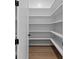 Walk-in pantry with custom shelving, providing ample storage space at 6120 Hutchins Dr, Buford, GA 30518