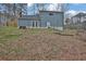 The rear exterior and backyard are seen in this image at 670 Westbrook Pl, Lawrenceville, GA 30044