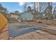 View of a blue backyard pool and the rear of the house at 670 Westbrook Pl, Lawrenceville, GA 30044