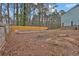 A tree-filled backyard with a wood fence at 670 Westbrook Pl, Lawrenceville, GA 30044