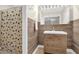 Gorgeous bathroom vanity with tile wall, shower curtain and great lighting at 670 Westbrook Pl, Lawrenceville, GA 30044