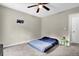 Comfortable bedroom with ceiling fan, carpeted floors, and lots of space at 670 Westbrook Pl, Lawrenceville, GA 30044
