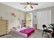 Well-lit bedroom with ceiling fan, carpeted floors, and closet at 670 Westbrook Pl, Lawrenceville, GA 30044