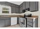 Kitchen featuring dark cabinets and stainless steel appliances at 670 Westbrook Pl, Lawrenceville, GA 30044