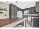 Cozy kitchen featuring black cabinets, an eat-in table, and natural light at 670 Westbrook Pl, Lawrenceville, GA 30044