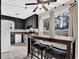 Cozy kitchen featuring black cabinets, an eat-in table, and natural light at 670 Westbrook Pl, Lawrenceville, GA 30044