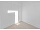 Walk-in closet with neutral carpet, white walls, and wire shelving and bright light at 1528 Parks Edge Nw Ln, Atlanta, GA 30318