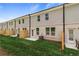 Townhome backyard featuring a small patio, privacy fence, and grassy area for outdoor enjoyment at 316 Shine Dr, Stockbridge, GA 30281