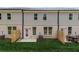 Townhome backyard featuring a small patio, and a grassy area perfect for outdoor enjoyment at 316 Shine Dr, Stockbridge, GA 30281