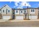 Charming townhomes with brick and siding exteriors, complemented by attached garages and neatly landscaped front yards at 316 Shine Dr, Stockbridge, GA 30281
