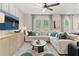 Bright and airy living room with a large sectional sofa, modern decor, and a flat-screen TV at 316 Shine Dr, Stockbridge, GA 30281