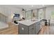 Open-concept living area with kitchen island and lots of natural light at 316 Shine Dr, Stockbridge, GA 30281