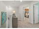 Hallway with open doorways, including a view of a bedroom with wood paneling at 316 Shine Dr, Stockbridge, GA 30281