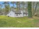 Back view of home with well-maintained backyard at 9053 Franklin Ct, Jonesboro, GA 30238
