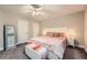 A bedroom with a queen-sized bed, carpet, and two windows at 9053 Franklin Ct, Jonesboro, GA 30238