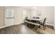 Dining room features modern furnishings and a door to the backyard at 9053 Franklin Ct, Jonesboro, GA 30238