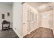 Bright entryway with modern floors, decor, and light fixture at 9053 Franklin Ct, Jonesboro, GA 30238