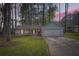 Charming single-Gathering home boasts a well-manicured front yard, driveway, and attached garage at 9053 Franklin Ct, Jonesboro, GA 30238