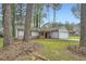 Charming single-Gathering home boasts a well-manicured front yard, driveway, and attached garage at 9053 Franklin Ct, Jonesboro, GA 30238