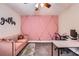 Charming home office featuring pink accent wall and modern decor at 9053 Franklin Ct, Jonesboro, GA 30238