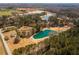 Breathtaking aerial view showcasing a pond surrounded by lush green trees, creating a tranquil setting at 96 Sam Alexander Rd, Douglasville, GA 30134