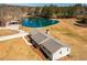Stunning aerial view of a charming home with a private pond and meticulously landscaped grounds at 96 Sam Alexander Rd, Douglasville, GA 30134