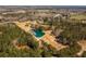 Scenic aerial perspective featuring a tranquil pond with homes in a wooded area, offering a peaceful and secluded atmosphere at 96 Sam Alexander Rd, Douglasville, GA 30134